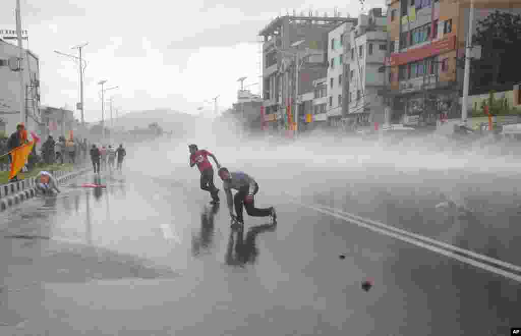 Nepalese police use water cannons to disperse Hindu protesters after they tried to enter a restricted area near the Constituent Assembly hall in Kathmandu. Nepal&#39;s Constituent Assembly rejected calls to revert the Himalayan nation back to a Hindu state during voting on a draft of the long-delayed new constitution.