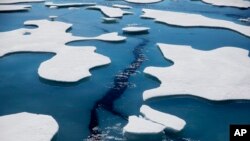 Sea ice breaks apart as the Finnish icebreaker MSV Nordica traverses the Northwest Passage through the Victoria Strait in the Canadian Arctic Archipelago in a Friday, July 21, 2017 file photo. (AP Photo/David Goldman, File)