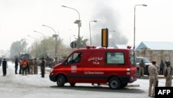 An ambulance arrives at the scene of a bomb attack in Baghdad, March 14, 2013.
