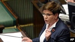 Critics denounce Polish Prime Minister Beata Szydlofor for making comments during a memorial observance at Auschwitz, June 14, 2015, that appeared to defend her tough anti-migrant policies, saying her words were inappropriate given the location.