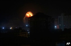 An explosion caused by Israeli airstrikes is seen on Gaza City, March 15, 2019.