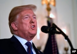 FILE - President Trump speaks in the Diplomatic Reception Room of the White House on, April 13, 2018, in Washington, about the United States' military response to Syria's April 7 chemical weapons attack.