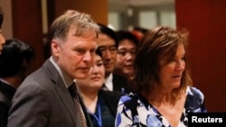 FILE - Fred Warmbier, right, and Cindy Warmbier, parents of Otto Warmbier, an American who died last year, days after his release from captivity in North Korea, wait for a meeting Thursday, May 3, 2018, at the United Nations headquarters. 