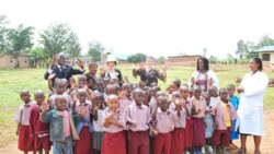 Members of the partnership's board of directors visit a school in Kigali, Rwanda