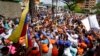 Opposition leaders Juan Guaido, center left, and Freddy Superlano, greet supporters during a demonstration in support of Superlano in Barinas, Venezuela, Dec. 4, 2021.