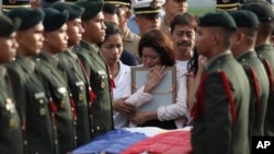 Relatives grieve for a soldier killed while fighting Abu Sayyaf militants in the southern Philippines. Services were at Villamor Air Base near Manila June 21, 2014.