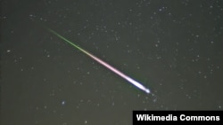 FILE - A meteor of the Leonid meteor shower. The photograph shows the meteor, afterglow, and wake as distinct components.