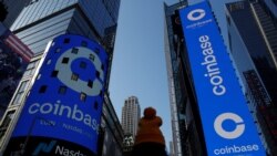 The logo for Coinbase Global Inc, the biggest U.S. cryptocurrency exchange, is displayed on the Nasdaq MarketSite jumbotron and others at Times Square in New York, U.S., April 14, 2021. REUTERS/Shannon Stapleton