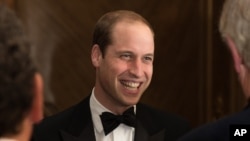 FILE - Britain's Prince William, Duke of Cambridge, talks with guests during the Tusk Conservation awards in London, Nov. 25, 2014.