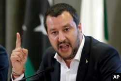 FILE - Italian Interior Minister Matteo Salvini makes a point during a joint press conference with Vice President of Libyan Parliamentary Council Ahmed Maitig, in Rome, July 5, 2018.