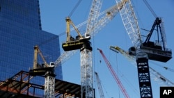 Cranes work at Hudson Yards construction site in New York, Nov. 23, 2015.