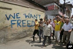 Kashmiri protesters shout pro-freedom slogans during a protest march in Srinagar, Indian controlled Kashmir, Aug. 11, 2016.