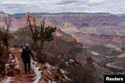 FILE - A person hikes on the Bright Angel Trail in the Grand Canyon near Grand Canyon Village, Arizona, U.S., February 22, 2018. (REUTERS/Stephanie Keith/File Photo)