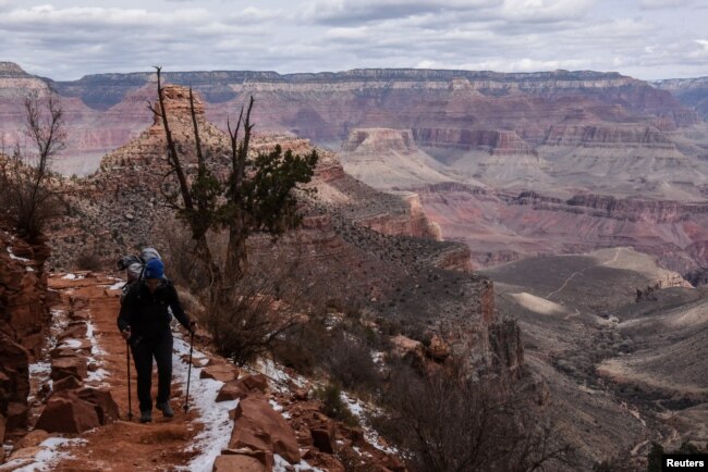 FILE - A person hikes on the Bright Angel Trail in the Grand Canyon near Grand Canyon Village, Arizona, U.S., February 22, 2018. (REUTERS/Stephanie Keith/File Photo)