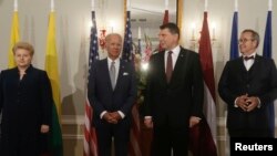 U.S. Vice President Joe Biden, Latvia's President Raimonds Vejonis (2R), Lithuania's President Dalia Grybauskaite (L) and Estonia's President Toomas Hendrik Ilves (R) pose for a picture in Riga castle, Latvia, Aug. 23, 2016. 