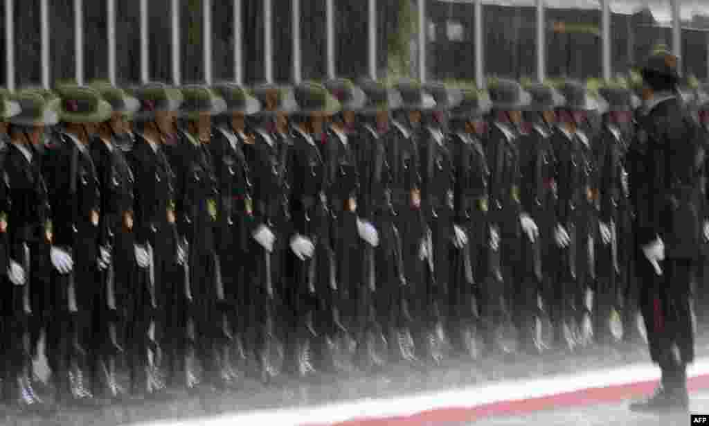 Nepali army personnel stand guard before the arrival of heads of state for the 4th Summit of the Bay of Bengal Initiative for Multi-Sectoral Technical and Economic Cooperation (BIMSTEC) summit, at Tribhuvan International Airport in Kathmandu.