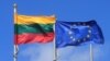 FILE - Lithuanian and European Union flags flutter at the Sudargas border crossing point with Russia in Ramoniskiai, Lithuania, June 5, 2017. 