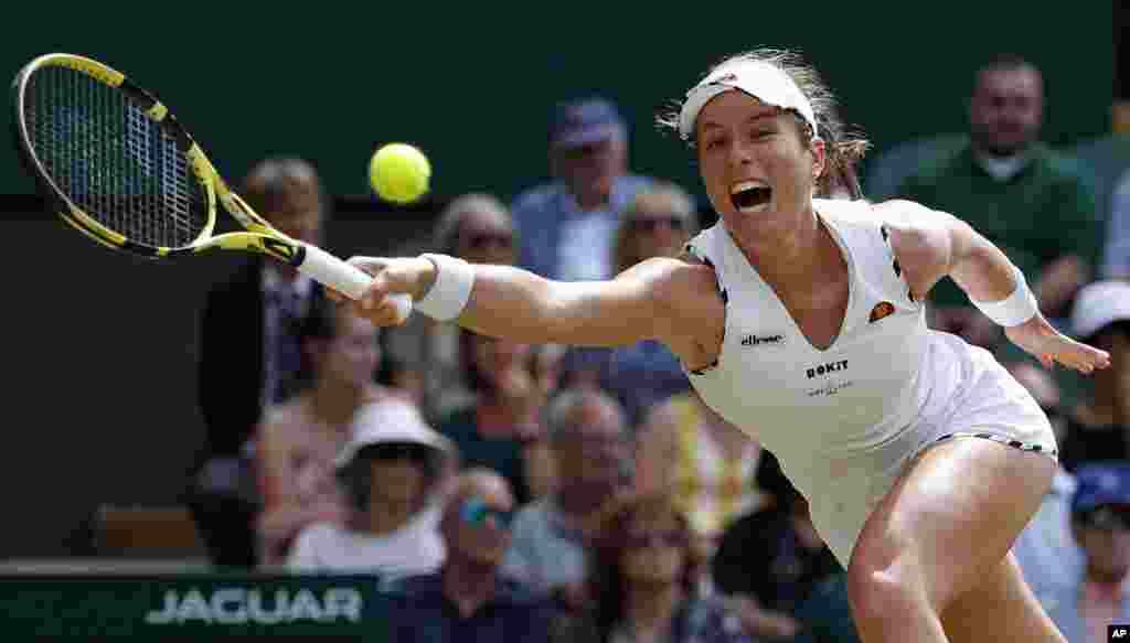 Britain's Johanna Konta returns to Czech Republic's Petra Kvitova in a women's singles match during day seven of the Wimbledon Tennis Championships in London.