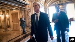 FILE - Special Counsel Robert Mueller departs after a closed-door meeting with members of the Senate Judiciary Committee about Russian meddling in the election and possible connection to the Trump campaign, at the Capitol in Washington, June 21, 2017.