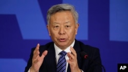FILE - Jin Liqun, inaugural president of the Asian Infrastructure Investment Bank (AIIB), speaks during a press conference at a hotel in Beijing, Jan. 17, 2016. China is now seriously considering the possibility of joining the TPP regime.