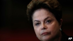 FILE - In this Oct. 6, 2014 file photo, Brazil's President Dilma Rousseff listens to a question during a campaign news conference at the Alvorada Palace, in Brasilia, Brazil. 