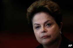 FILE - In this Oct. 6, 2014 file photo, Brazil's President Dilma Rousseff listens to a question during a campaign news conference at the Alvorada Palace, in Brasilia, Brazil.
