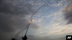 An Iron Dome missile is launched in Tel Aviv to intercept a rocket launched from Gaza, November 17, 2012.