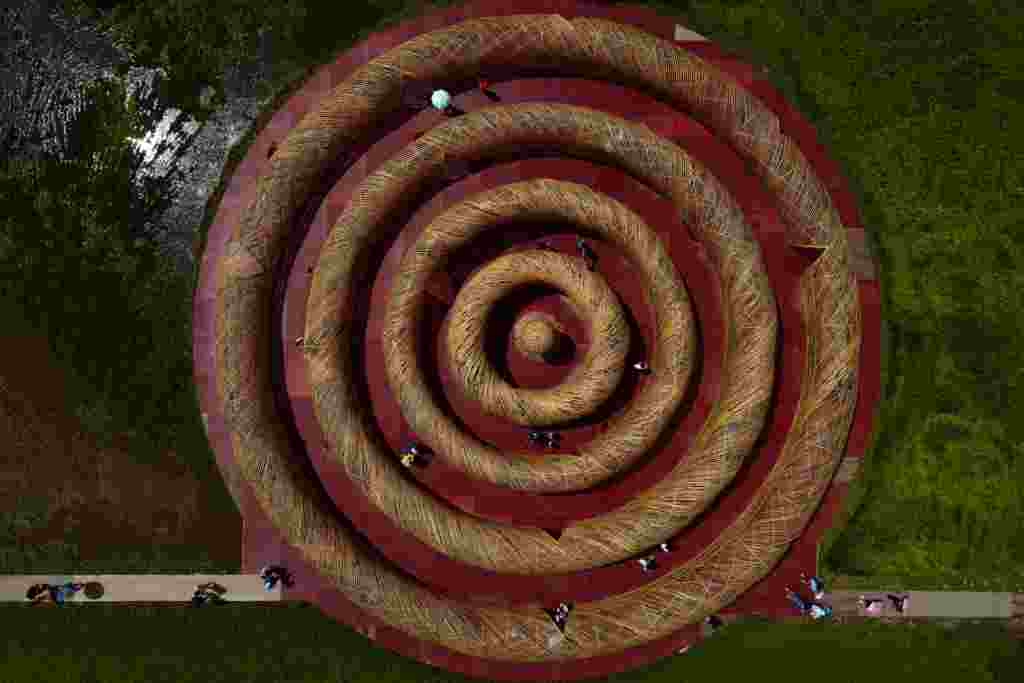 An aerial view shows tourists visiting an art installation &#39;The ripple maze at Gaoshuang&#39; made of bamboo by Taiwanese artist Lee Kuei-chih during the Art Land Festivals in Taoyuan, Taiwan.