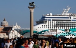 FILE - The Norwegian Jade cruise ship is seen from St. Mark square in Venice lagoon, June 16, 2012.