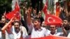 Turks hold national flags as they march in Ankara, Turkey to protest the killings of soldiers , Wednesday, June 20, 2012, a day after Kurdish rebels attacked Turkish military units with mortars and rocket-propelled grenades in the Daglica area of Hakkari