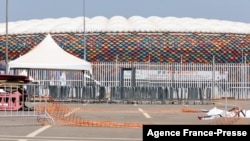 Barriers on the ground at the scene of the stampede are seen at the entrance of Olembe stadium in Yaounde, Jan. 25, 2022. Eight people were killed and many more injured in a crush outside a Cameroonian football stadium, Jan. 24, 2022, before an Africa Cup