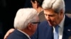 U.S. Secretary of State John Kerry (R) speaks to German Foreign Minister Frank-Walter Steinmeier at the Munich Security Conference in Munich, Germany, Feb. 13, 2016. 