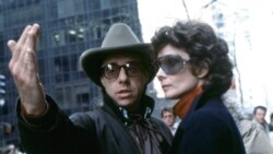 FILE - Director Peter Bogdanovich gives actress Audrey Hepburn instructions during the filming at New York's Rockefeller Center of "They All Laughed" in 1980.