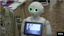 This retail-oriented humanoid robot can read human emotions and speak multiple languages. (R. Taylor/VOA)