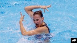 Switzerland's Sascia Kraus performs during the Solo Free Synchronized Swimming final during the European Aquatics Championships at the London Aquatics Centre in London.