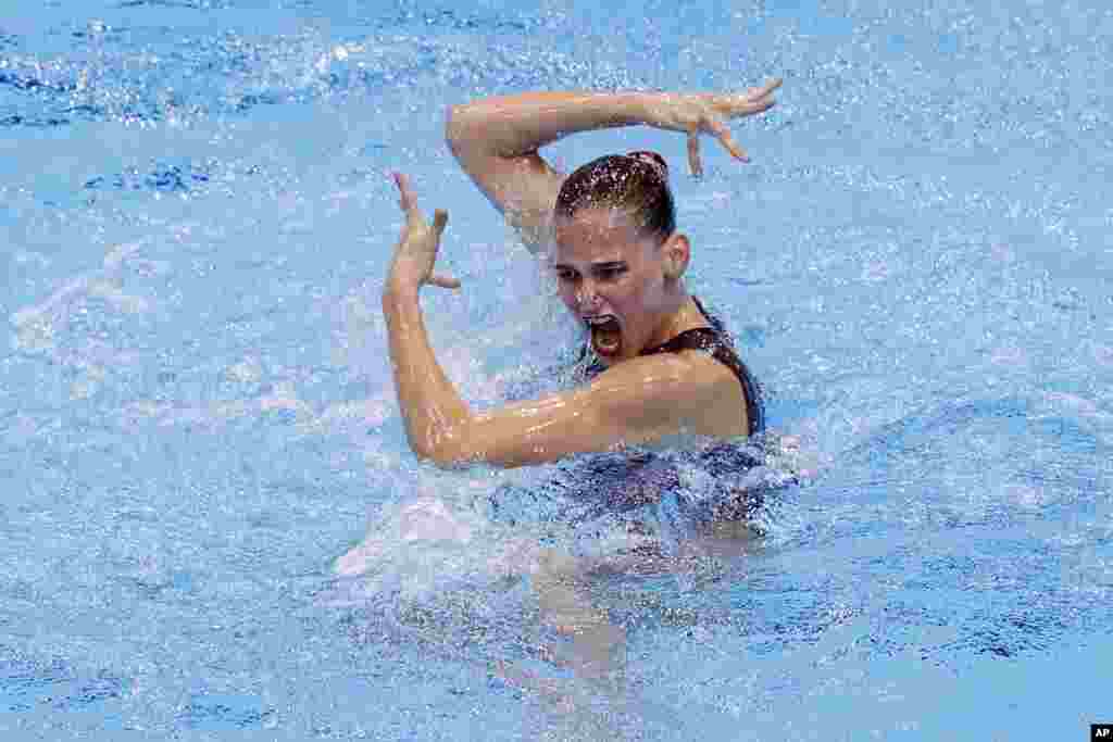 Switzerland's Sascia Kraus performs during the Solo Free Synchronized Swimming final during the European Aquatics Championships at the London Aquatics Centre in London.