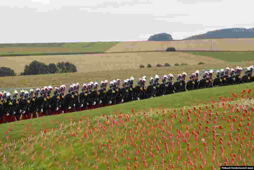 Members of the Saint Cyr military school march a day before the ceremony to mark the centenary of the Battle of the Somme at the Thiepval monument, in Thiepval, near Amiens, northern France.