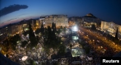 Protesters attend an anti-austerity rally in front of the parliament building in Athens, Greece, June 29, 2015.