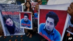 FILE - Members of a Pakistani civil society demonstrate April 22, 2017, in Karachi, Pakistan, against the killing of Mashal Khan, a student at the Abdul Wali Khan University in the northwestern city of Mardan. Police say the lynching of Khan, falsely accu