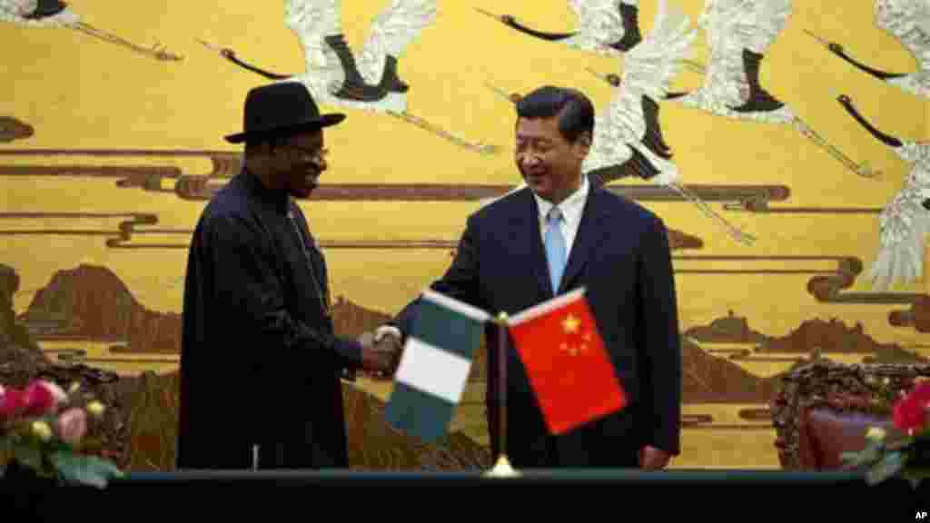 Chinese President Xi Jinping shakes hands with President Jonathan after the two country's ministers signed several agreement.