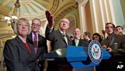 Senate Majority Leader Harry Reid, center, leads Senate Democrats' news conference on Capitol Hill, March 1, 2012.