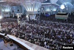 People listen to Iran's Supreme Leader Ayatollah Ali Khamenei as he speaks at a ceremony marking the 30th anniversary of the death of founder of the Islamic Republic Ayatollah Ruhollah Khomeini in Tehran, Iran, June 4, 2019.