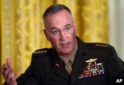 FILE - Gen. Joseph Dunford, the chairman of the Joint Chiefs of Staff, speaks during the National Space Council meeting in the East Room of the White House in Washington, June 18, 2018.