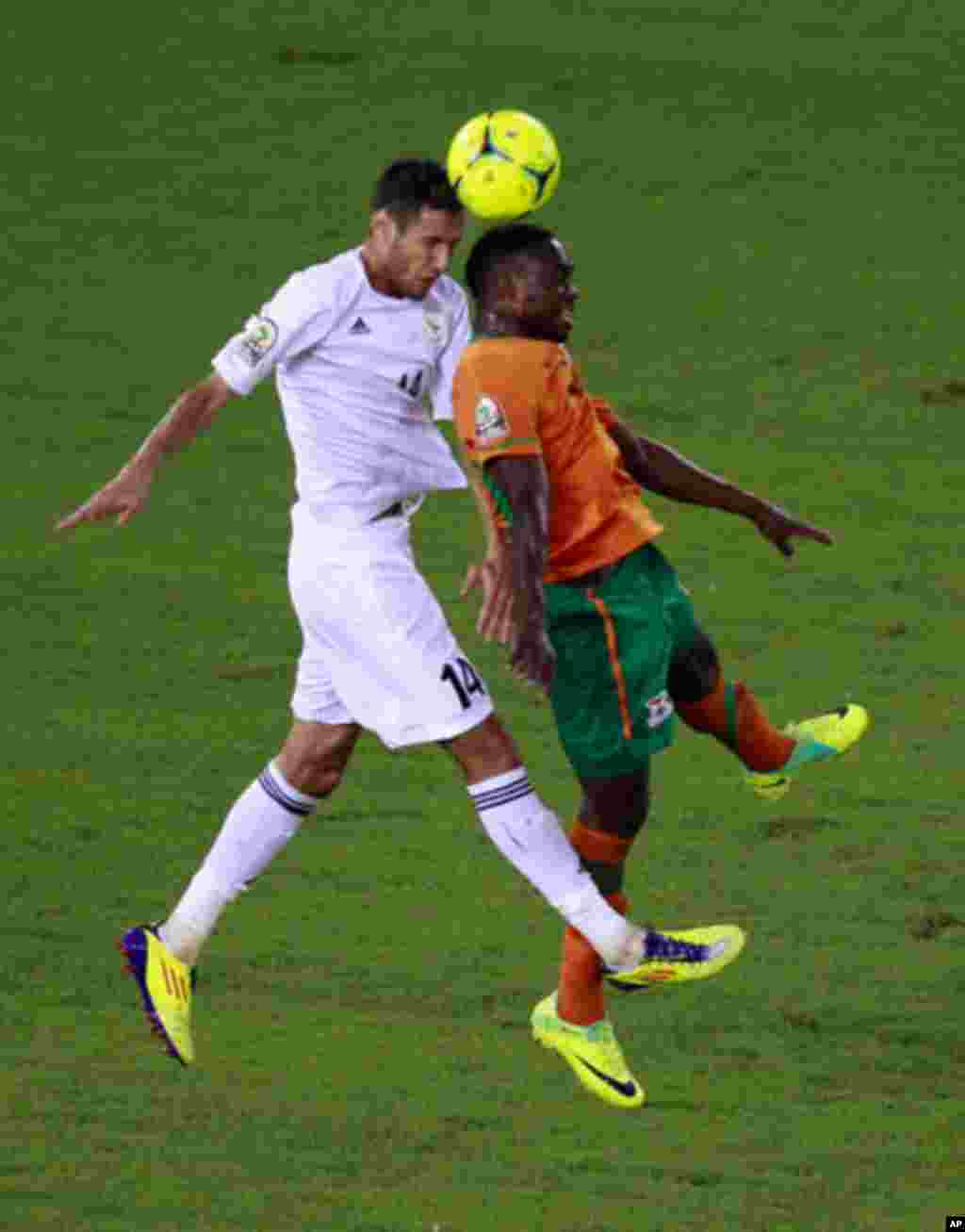 Mayuka of Zambia challenges Salama of Libya during their African Nations Cup Group A soccer match at Estadio de Bata "Bata Stadium", in Bata