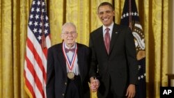 FILE - President Barack Obama awards the National Medal of Technology and Innovation to Art Rosenfeld of Lawrence Berkeley National Laboratory, Feb. 1, 2013, during a ceremony in the East Room of the White House in Washington. 
