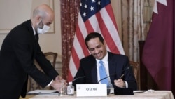 Qatar's Foreign Minister Sheikh Mohammed bin Abdulrahman Al Thani and Secretary of State Antony Blinken, not pictured, participate in a signing ceremony at the State Department in Washington, Friday, Nov. 12, 2021.