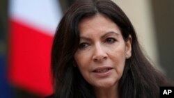 FILE - Paris mayor Anne Hidalgo speaks to the media after a meeting at the Elysee Palace, in Paris, France, March 9, 2017. 
