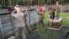 U.S. Marines from Marine Wing Support Detachment (MWSD) 31, climb across a rope during the Leadership Reaction Course on Marine Corps Recruit Depot Parris Island, South Carolina, Aug. 12, 2017. 