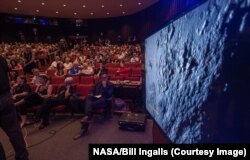 New Horizons media briefing shows some of the first data and images collected since the spacecraft's fly-by of Pluto, at the Johns Hopkins University Applied Physics Laboratory (APL), Laurel, Maryland, July 15, 2015.