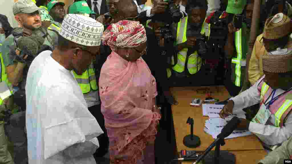 General Muhammadu Buhari, the Pesidential candidate of the opposite APC and his wife, Aishatu Buhari, been accredited at their polling unit, Kofar Faru III in Daura, Katsina state.